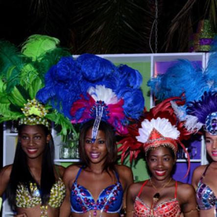 Winston Sill/Freelance Photographer
J. Wray and Nephew host Yardi Gras 2014 the annual Media Party, held at Countryside Club, Courtney Walsh Drive on Tuesday night March 18, 2014. Here are Ashlie Bennett (left);  Kamika Blake (second left); Jheanelle Smith (second right); and Safia king (right).