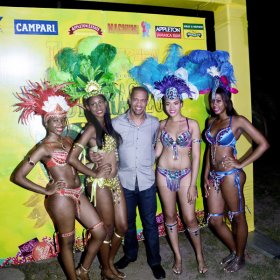 Winston Sill/Freelance Photographer
J. Wray and Nephew host Yardi Gras 2014 the annual Media Party, held at Countryside Club, Courtney Walsh Drive on Tuesday night March 18, 2014. Here are Jheanelle Smith (left); Ashlie Bennett (second left); Gary Dixon (centre); Safia King (second right); and Kamika Blake (right).