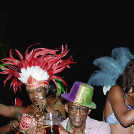 Winston Sill/Freelance Photographer
J. Wray and Nephew host Yardi Gras 2014 the annual Media Party, held at Countryside Club, Courtney Walsh Drive on Tuesday night March 18, 2014. Here are Jheanelle Smith (left0; Clement Jimmy Lawrence (centre); and Kamika Blake (right).