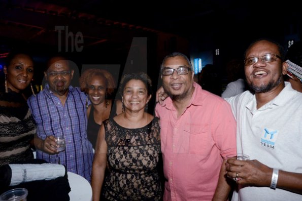 Winston Sill/Freelance Photographer
Yush Party and Performance Show, held at the National Indoor Sports Centre (NISC),  Stadium Complex on Saturday night December 27, 2014. Here are Dianne Barnes (left); Wade Marsh (second left); Gillian Smith (third left); Marcia McDonnough (centre), who was celebrating her birthday:  Dr. David Smith (second right); and Michael Creary (right).